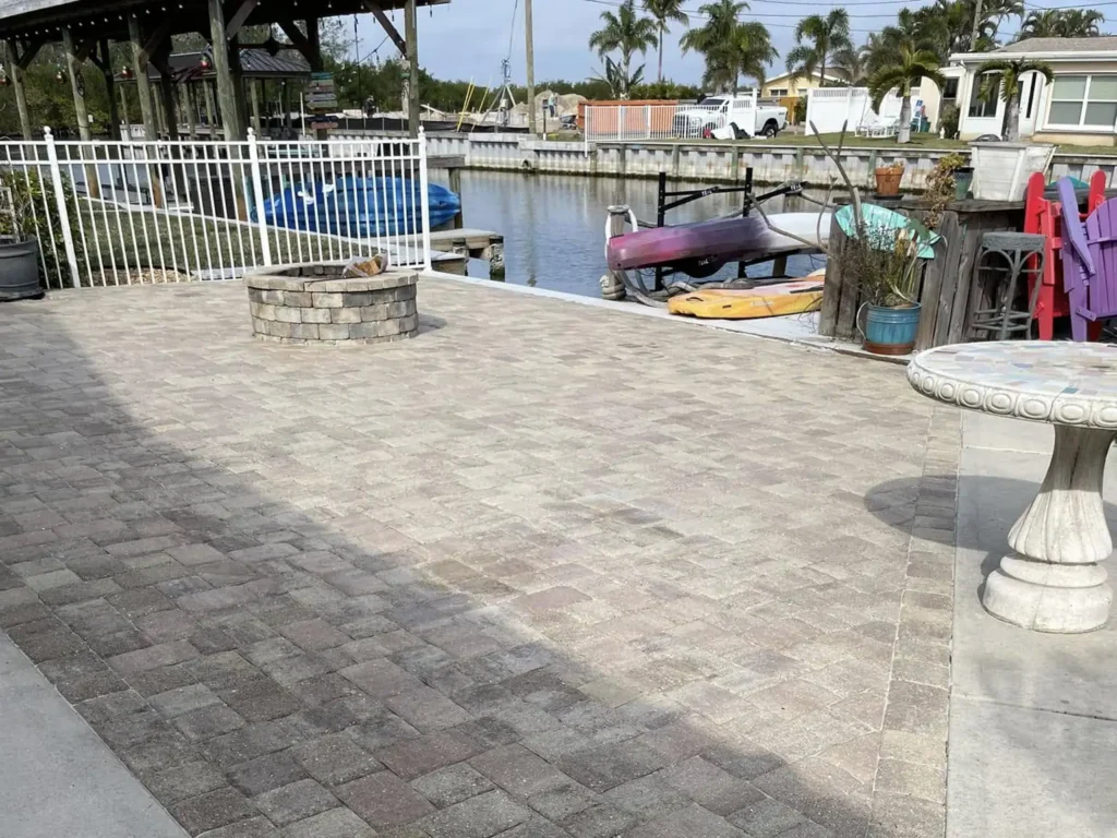 Circular paver layout installed around fire pit in Palm Bay